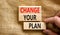 Change your plan symbol. Concept words Change your plan on wooden blocks on a beautiful canvas table canvas background.