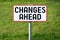 Changes ahead - signboard, grass in background