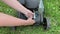 Changing replacing lawn mower spark plug, landscape equipment repair service, process of unscrewing spark plug