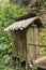 Changing room built of bamboo trunks by a river in a tropical rain forest. Small house at Spray Waterfall on Bali Island high in