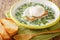 Changua is quite simply an egg and milk soup, but it`s warming, hearty and absolutely delicious closeup in the plate. horizontal