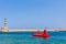 CHANIA, CRETE - 22 JULY 2021: A semi-submarine tourist boat entering the old Venetian port of Chania, Crete