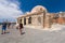 Chania, Crete - June 26, 2016: The Mosque Kioutsouk meaning little Hassan is located at the Venetian Port of Chania.
