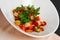 Chanterelle salad with peas, tomato and potato