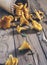 Chanterelles on vintage wooden background top view, healthy food on table mockup, orange mushrooms isolated on rustic country boar