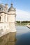 Chantilly castle tower and gardens with pond