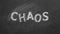 Chaos. Text on blackboard