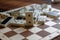 Chaotic pile of domino pieces on the bamboo brown wooden table background