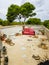 Chaotic roof terrace with a red couch hostel in Mallorca