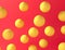 Chaotic yellow balls on a red background. Abstract color composition. Minimalist style. 3D rendering