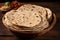 Chapati on wooden background, representing authentic Indian traditional cuisine