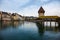 Chapel Bridge, wooden bridge with grand stone water tower - Luzern, Switzerland