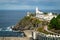 Chapel with cemetery and a lighthouse in Luarca, Spain