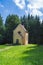 Chapel in a forest clearing