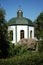 Chapel in frame of trees, stones and sky