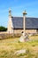 The chapel of Saint-Nicolas in Bugueles, Brittany, France, with its calvary on a sunny summer day