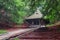 Chapel of St. Roch in KrasnobrÃ³d, Roztocze, Poland. Beautiful wooden sacral building situated on a hill between trees