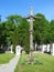 Chapel and wooden cross in churchyard, Lithuania