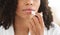 Chapped Lips Remedies. Closeup Of Black Woman Applying Chapstick Moisturizing Lip Balm