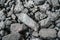 Char-coal. Pattern, heap. Pile of Bituminous Coal cinder. Stone coal Industry, business. Black coal mine close-up with soft focus