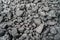 Char-coal. Pattern, heap. Pile of Bituminous Coal cinder. Stone coal Industry, business. Black coal mine close-up with soft focus