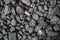 Char-coal. Pattern, heap. Pile of Bituminous Coal cinder. Stone coal Industry, business. Black coal mine close-up with soft focus