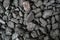 Char-coal. Pattern, heap. Pile of Bituminous Coal cinder. Stone coal Industry, business. Black coal mine close-up with soft focus