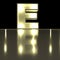 Character E font with reflection. Light bulb glowing letter alph