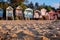 Characterful, colourful beach huts on the sea front at Wells-next-the-Sea, North Norfolk UK. Huts are photographed at golden hour.