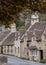 Characterful, historic houses in Castle Combe, picturesque village in Wiltshire in the Cotswolds, UK. Photographed in autumn.