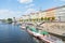 Characteristic architecture and tourist boats alongside promenad