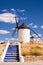 Characteristic blue painted staircase and Consuegra Windmill (Spain)