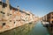 Characteristic canal in Chioggia, lagoon of Venice.