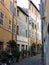 Characteristic narrow street in the historical center of Rome in Italy.