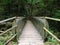 Characteristic pedestrian wooden bridge with a metal grating par