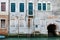 Characteristic venetian building with a stair near a window to enter in the house, Venice