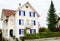 Characteristic white house with blue windows in Bremgarten, Switzerland