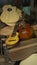 Charango and red wood guitar on a pile of unassembled guitar parts