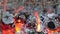 Charcoal burning in stone hearth - Closeup bright flames of fire burning on pieces of charcoal inside stone hearth