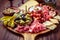 Charcuterie, antipasti platter with assortment of italian salami, cheese, camembert and olives