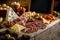 Charcuterie board close up over rustic wooden table