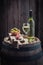 Chardonnay wine, olives and cold cuts on oak barrel