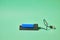 charger for blue 18650 battery on green background