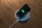 The charging mobile phone with wireless charger, 3d rendering