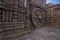 A chariot wheel carved into the wall of the 13th century Konark Sun or Surya Temple, Odisha, India.