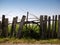 Chariot wheel on a wooden fence