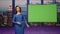 Charismatic anchorwoman talking green screen tv studio. Woman lighting news