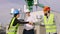 Charismatic businessman and his construction team together on the top of the construction site put hand over hand and