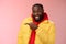 Charismatic carefree handsome black bearded guy in yellow jacket laughing friendly look camera chat pointing left show