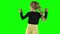 Charismatic female child dancing over green background.